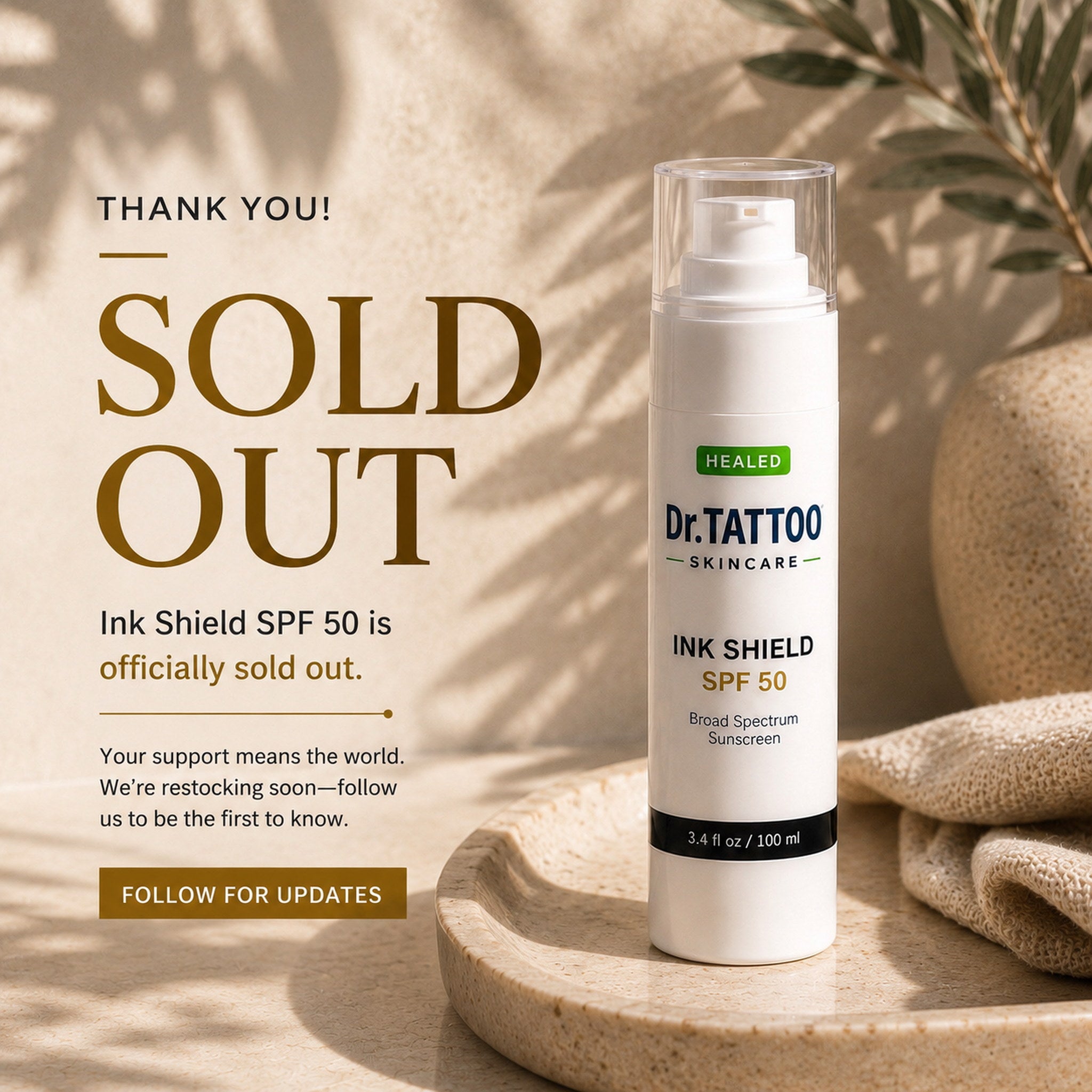 Dr. Tattoo Ink Shield SPF 50 sunscreen bottle with 'SOLD OUT' text on a natural background